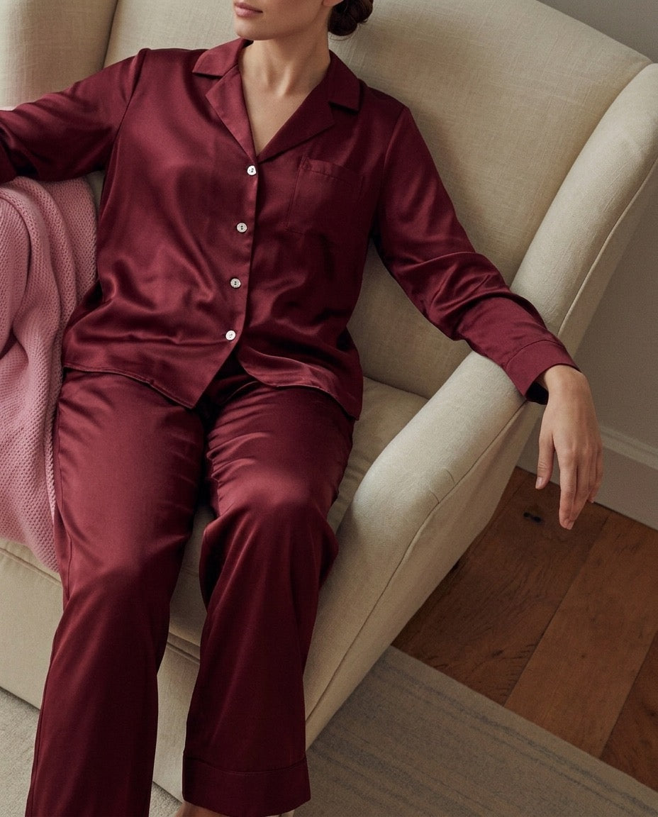 woman wearing burgundy silk pyjamas